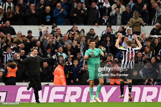 Nick Pope of Newcastle United celebrates with Matt Targett of Newcastle United following their sides victory after a penalty shoot out during the...