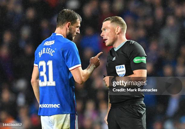 Borna Barisic of Rangers argues with the referee John Beato during the Cinch Scottish Premiership match between Rangers FC and Heart of Midlothian at...