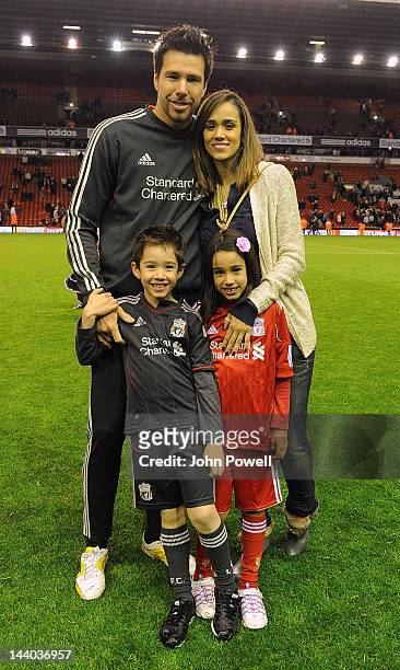 Doni and family pose for pictures at the end of the Barclays Premier League match between Liverpool and Chelsea at Anfield on May 8, 2012 in...