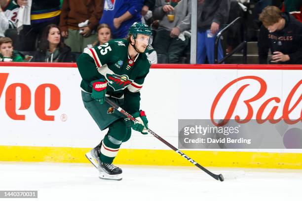 Jonas Brodin of the Minnesota Wild skates with the puck against the New York Rangers in the third period of the game at Xcel Energy Center on October...