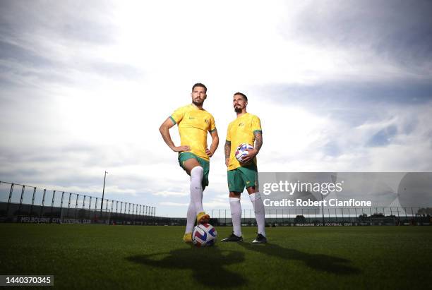 Mathew Leckie and Jamie Maclaren of Melbourne City pose in the Socceroo kit after they were named as part of the Australian 2022 FIFA World Cup...