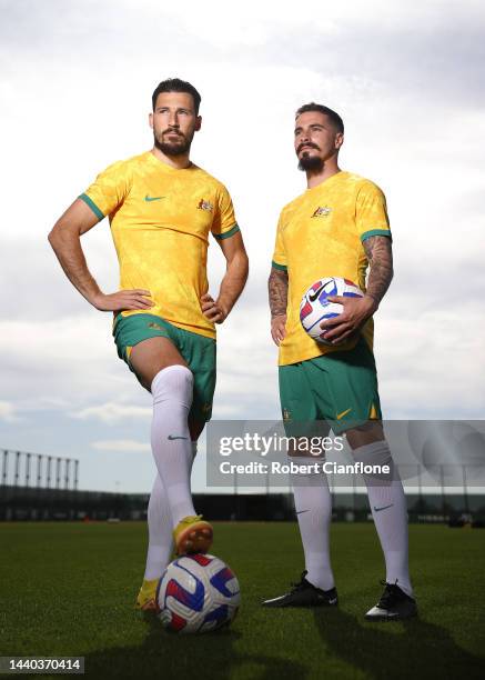 Mathew Leckie and Jamie Maclaren of Melbourne City pose in the Socceroo kit after they were named as part of the Australian 2022 FIFA World Cup...