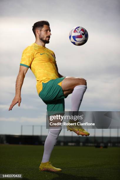 Mathew Leckie of Melbourne City poses in the Socceroo kit after he was named as part of the Australian 2022 FIFA World Cup squad, during a Melbourne...