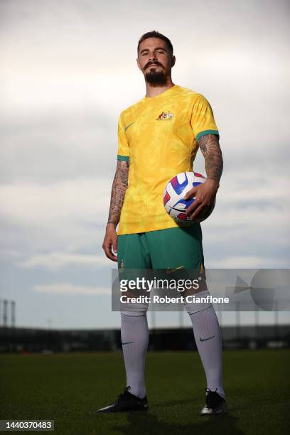Jamie Maclaren of Melbourne City poses in the Socceroo kit after he was named as part of the Australian 2022 FIFA World Cup squad, during a Melbourne...