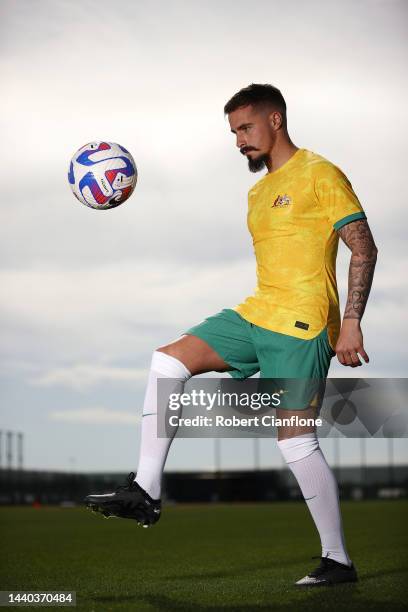 Jamie Maclaren of Melbourne City poses in the Socceroo kit after he was named as part of the Australian 2022 FIFA World Cup squad, during a Melbourne...