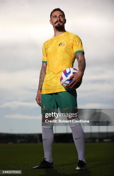 Jamie Maclaren of Melbourne City poses in the Socceroo kit after he was named as part of the Australian 2022 FIFA World Cup squad, during a Melbourne...