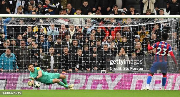 Newcastle United goalkeeper Nick Pope dives to save a penalty from Crystal Palce player Malcolm Ebiowei to win the match for Newcastle during the...