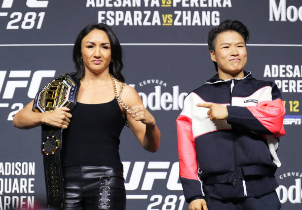 Opponents Carla Esparza and Zhang Weili of China pose on stage during the UFC 281 press conference at Madison Square Garden on November 09, 2022 in...