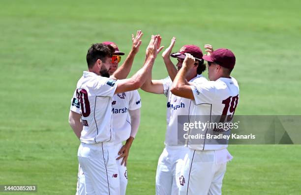 Michael Neser of Queensland celebrates taking the wicket of Peter Handscomb of Victoria during the Sheffield Shield match between the Queensland...