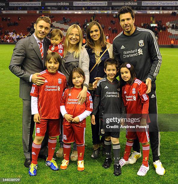 Fabio Aurelio and Alexander Doni of Liverpool and their families at the end of the Barclays Premier League match between Liverpool and Chelsea at...
