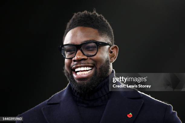 Former Footballer and TV Pundit, Micah Richards smiles prior to the Carabao Cup Third Round match between Manchester City and Chelsea at Etihad...