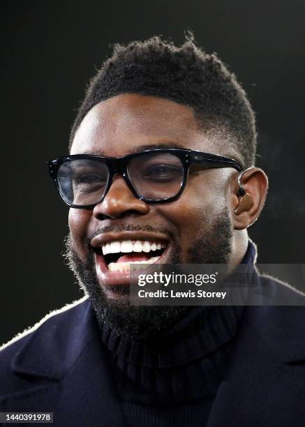 Former Footballer and TV Pundit, Micah Richards smiles prior to the Carabao Cup Third Round match between Manchester City and Chelsea at Etihad...