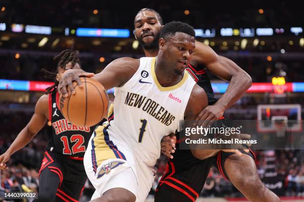 Zion Williamson of the New Orleans Pelicans drives to the basket against Patrick Williams of the Chicago Bulls during the first half at United Center...