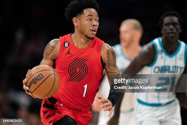 Anfernee Simons of the Portland Trail Blazers brings the ball up court in the fourth quarter against the Charlotte Hornets at Spectrum Center on...