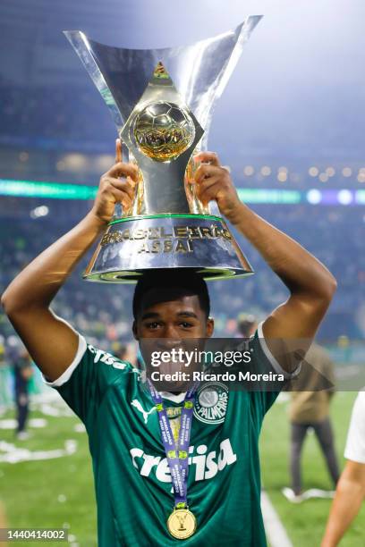 Endrick of Palmeiras celebrates with champions the trophy after the match between Palmeiras and America MG as part of Brasileirao Series A 2022 at...