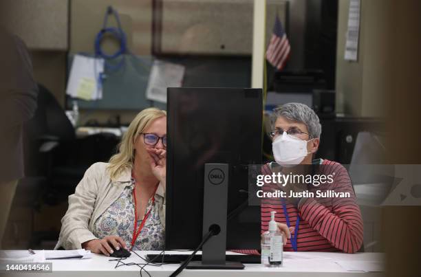 Members of an adjudication board review ballots at the Maricopa County Tabulation and Election Center on November 09, 2022 in Phoenix, Arizona....