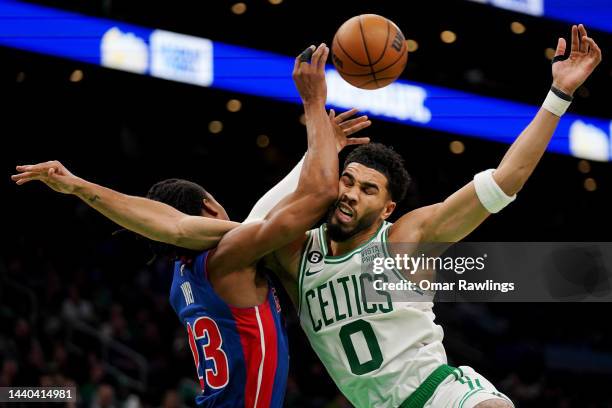 Jayson Tatum of the Boston Celtics is hit in the face by Jaden Ivey of the Detroit Pistons while contesting a rebound during the fourth quarter of...