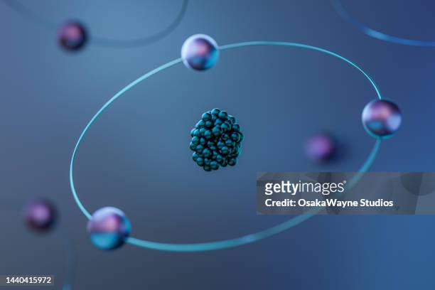 spheres orbiting an atom - elettrone foto e immagini stock