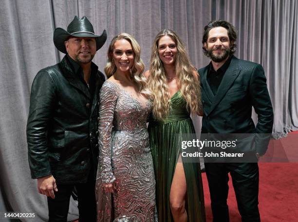 Jason Aldean, Brittany Aldean, Lauren Akins and Thomas Rhett pose backstage during the 56th Annual Country Music Association Awards at Bridgestone...