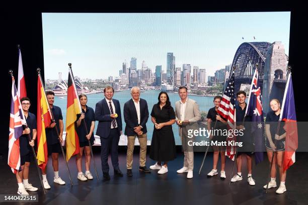 Stephen Farrow, Wally Masur, Casey Dellacqua and Todd Woodbridge pose with young tennis participants during the 2023 United Cup Official Draw at...