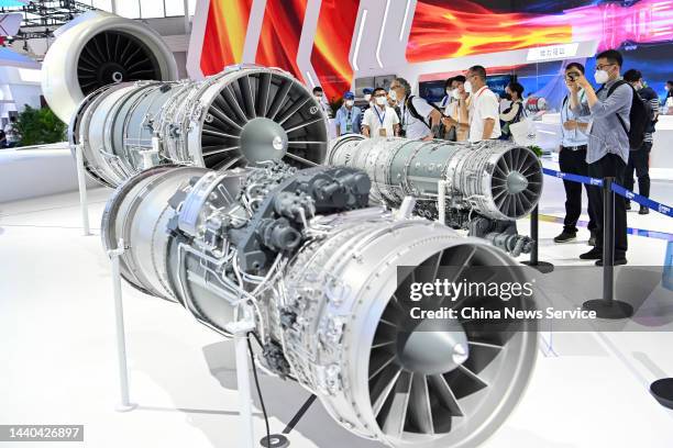 Visitor views the Taihang turbofan engines exhibited at the 14th China International Aviation and Aerospace Exhibition, or Airshow China 2022, on...