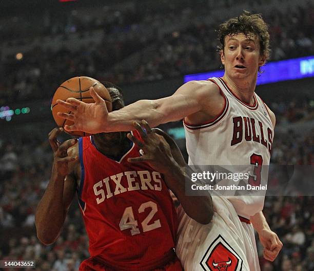 Omer Asik of the Chicago Bulls knocks the ball away from Elton Brand of the Philadelphia 76ers in Game Five of the Eastern Conference Quarterfinals...