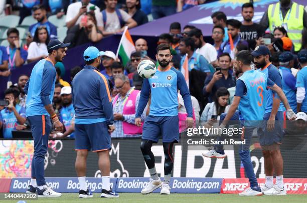 Virat Kohli of India warms up with a game of soccer during the ICC Men's T20 World Cup Semi Final match between India and England at Adelaide Oval on...