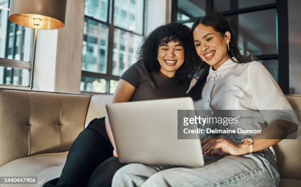 friends, laptop and movie with a young woman and friend watching or streaming a series on the internet at home. computer, video and comedy with females laughing while sitting on a living room sofa - content stock pictures, royalty-free photos & images