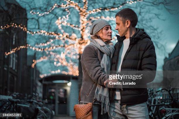 a foreign traveller couple on a date at winter xmas shopping in delft - straight bildbanksfoton och bilder