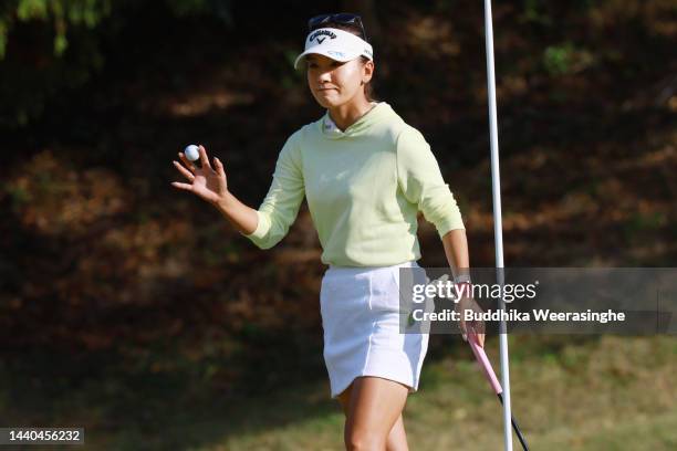 Hikari Fujita of Japan acknowledges the gallery after holing out on the 18th green during the first round of the Yamaguchi Shunan Ladies Cup at...