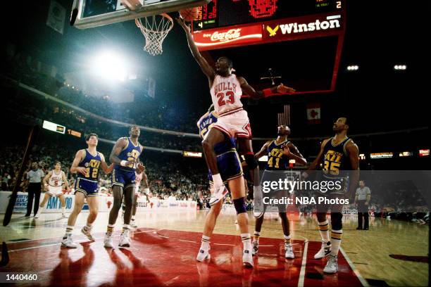 Michael Jordan of the Chicago Bulls drives to the basket for a layup against the Utah Jazz in Chicago, IL. NOTE TO USER: User expressly acknowledges...