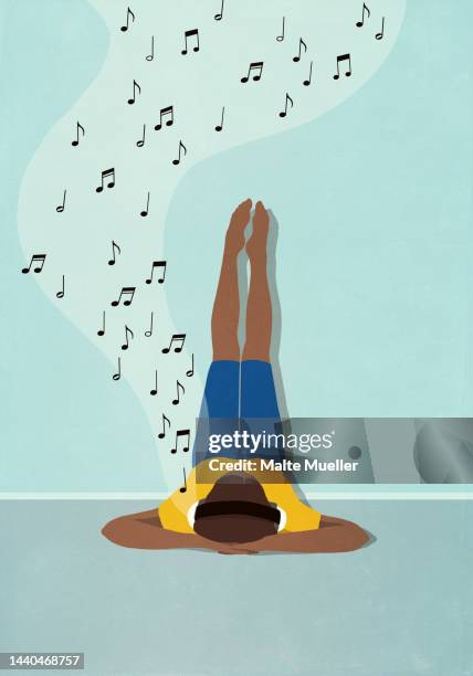 woman relaxing, listening to music with headphones and legs up the wall - listening stock illustrations