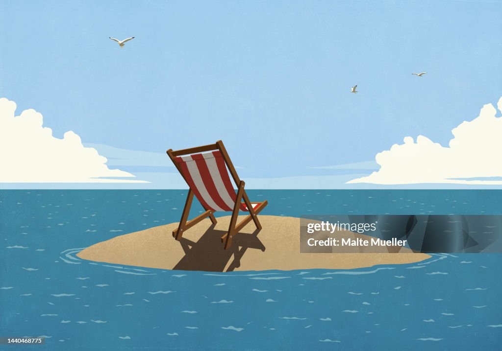 Striped folding chair on sunny, remote ocean island