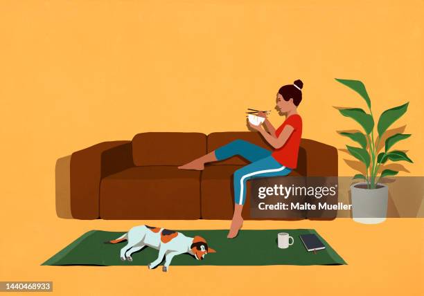dog sleeping below woman relaxing, eating on sofa at home - dog yellow background stock illustrations