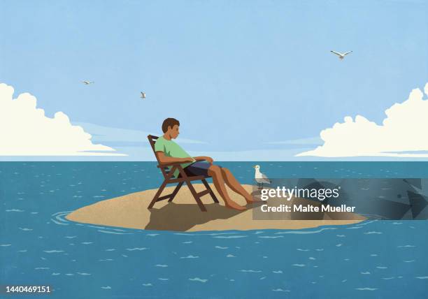 man relaxing on remote desert ocean island - day dreaming stock illustrations