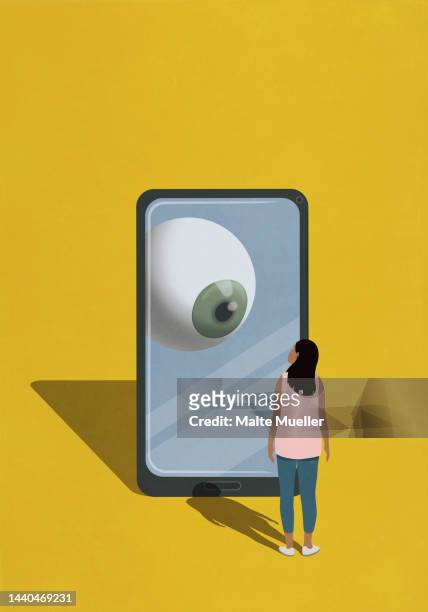 bildbanksillustrationer, clip art samt tecknat material och ikoner med large eyeball on smart phone watching woman - spionprogram