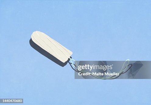 Tampon with string on blue background Tampon with string on blue background