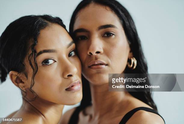 beauty, skincare and aesthetic women in studio for cosmetics, makeup and dermatology for health, wellness and skin. different females posing together for friends, lgbtq or lesbian magazine cover - fashion model couple stock pictures, royalty-free photos & images