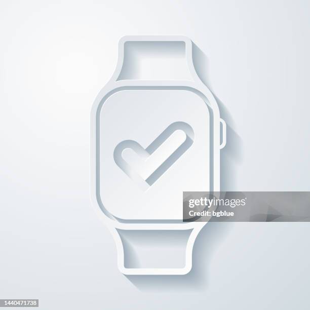 smartwatch with check mark. icon with paper cut effect on blank background - checking smart watch stock illustrations