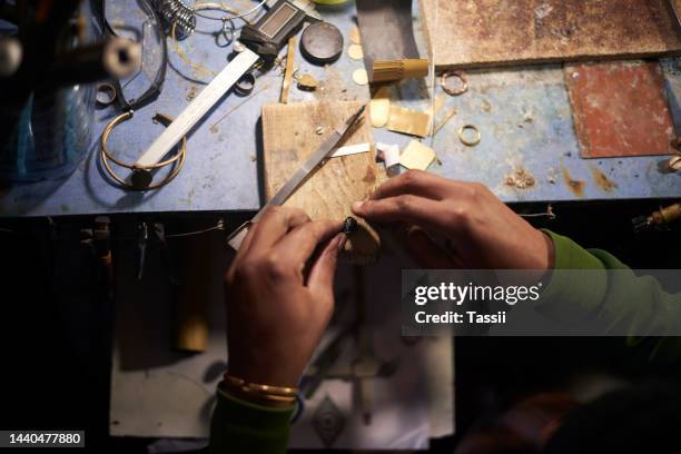 carpenter, wood workshop and hands of man doing a repair, building an object or making wooden furniture. carpentry industry job, craft and workplace handyman working with professional hardware tools - juwelier stockfoto's en -beelden