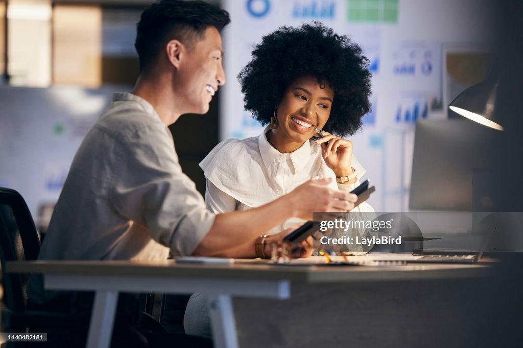 Business night, black woman with man and tablet working together in office, data analytics statistics in fintech. Finance team, black people workplace or professional teamwork with mobile technology