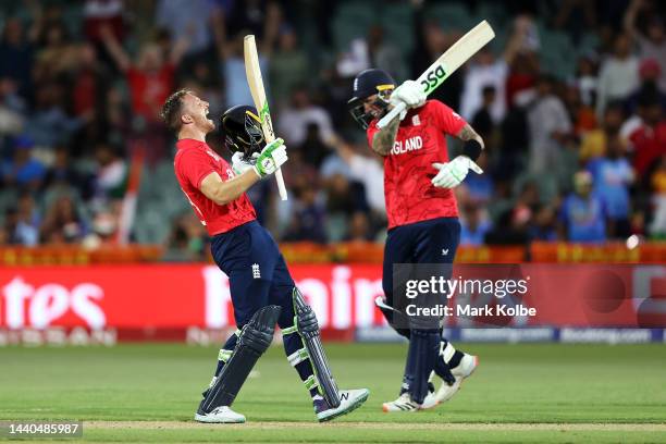 Jos Buttler and Alex Hales of England celebrate victory during the ICC Men's T20 World Cup Semi Final match between India and England at Adelaide...