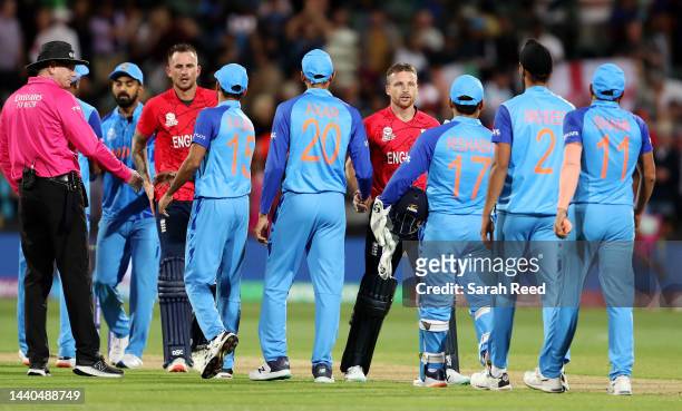 Jos Buttler of England and Alex Hales of England after the win with the Indian players during the ICC Men's T20 World Cup Semi Final match between...