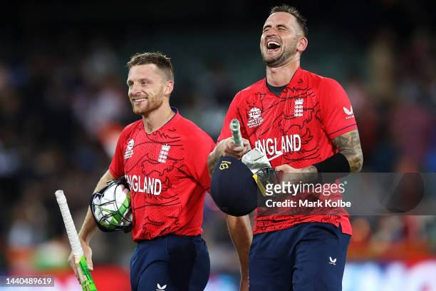 Jos Buttler and Alex Hales of England share a laugh as they celebrate victory during the ICC Men's T20 World Cup Semi Final match between India and...
