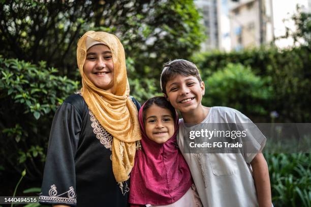 portrait of happy siblings outdoors - lebanon stock pictures, royalty-free photos & images