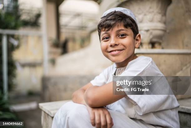 portrait of a cute islamic boy - cute muslim boys stock pictures, royalty-free photos & images