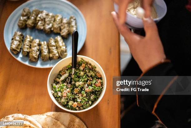 female hands preparing arab food at home - stuffed cabbage stock pictures, royalty-free photos & images