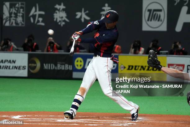 Outfielder Ukyo Shuto of Japan hits a sacrifice fly to make it 5-0 in the sixth inning during the game between Samurai Japan and Australia at Sapporo...