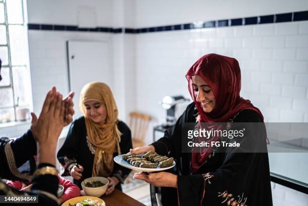 islamic women preparing food at home - lebanese ethnicity stock pictures, royalty-free photos & images