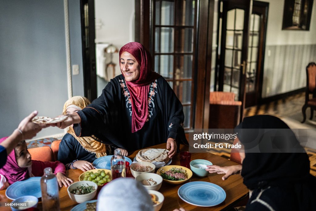 Islamic family having lunch together at home